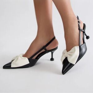 Black kitten heels with white bow